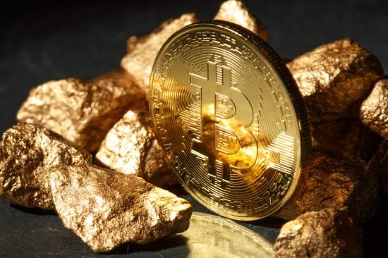 Golden Bitcoin Coin and mound of gold. Bitcoin cryptocurrency. Business concept.